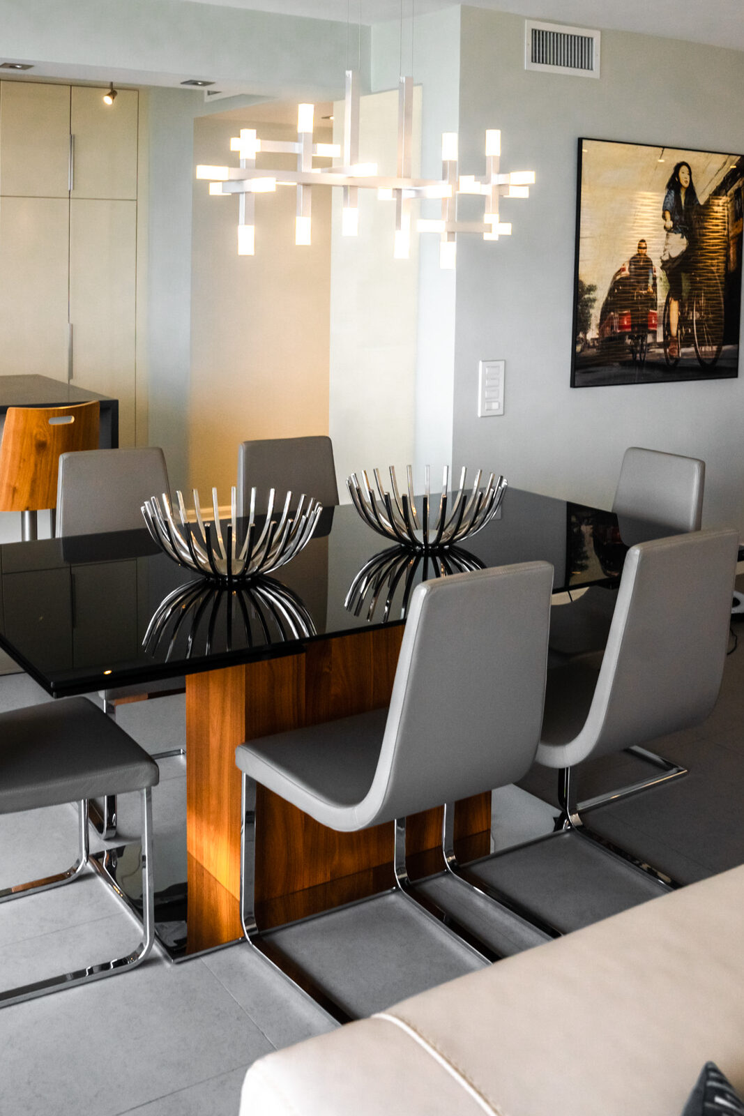 A dining room featuring a wooden table surrounded by elegant chairs, creating a warm and inviting atmosphere.