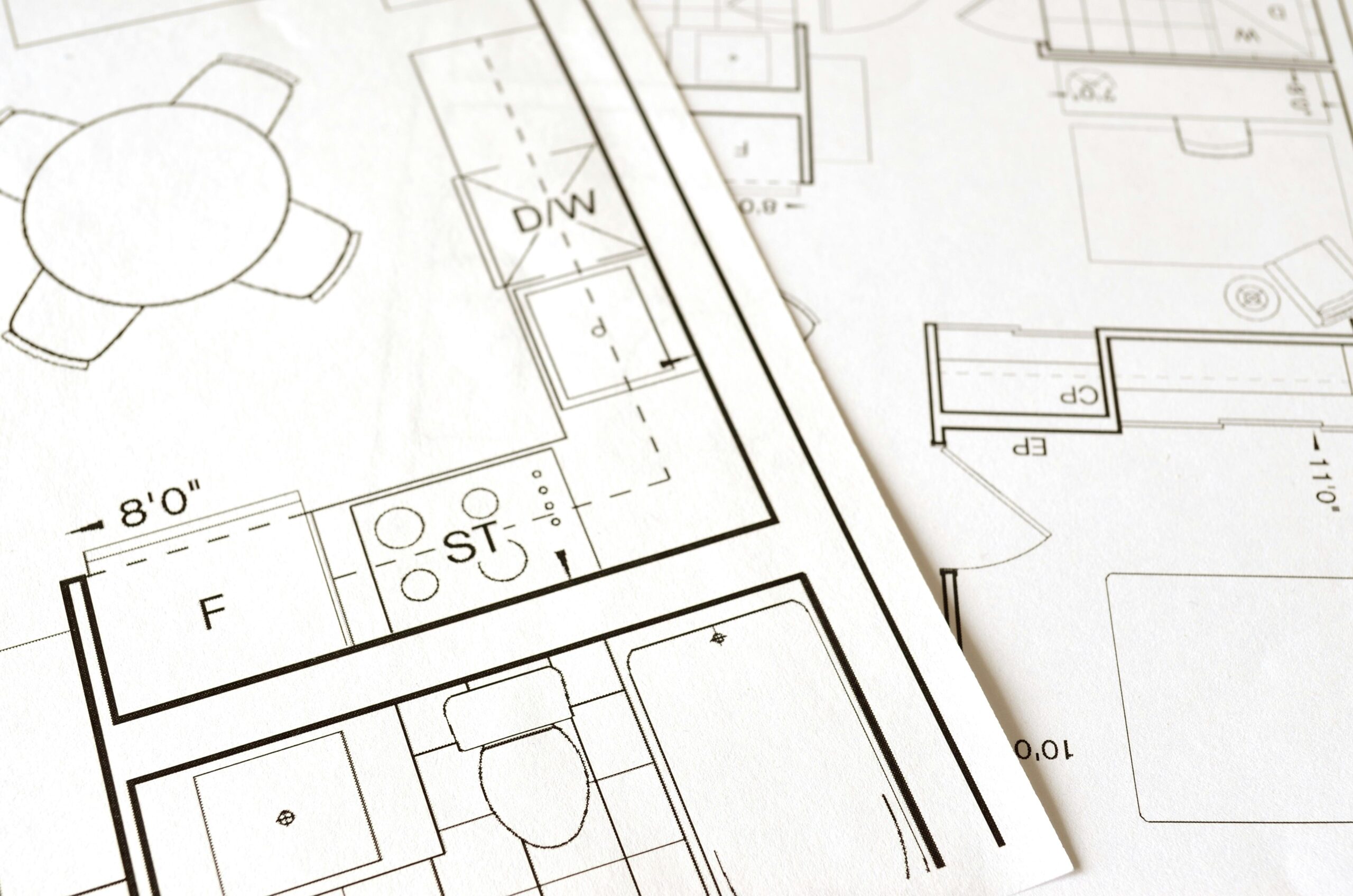  Blueprint of a house featuring detailed layouts of a kitchen and bathroom, showcasing room dimensions and design elements.